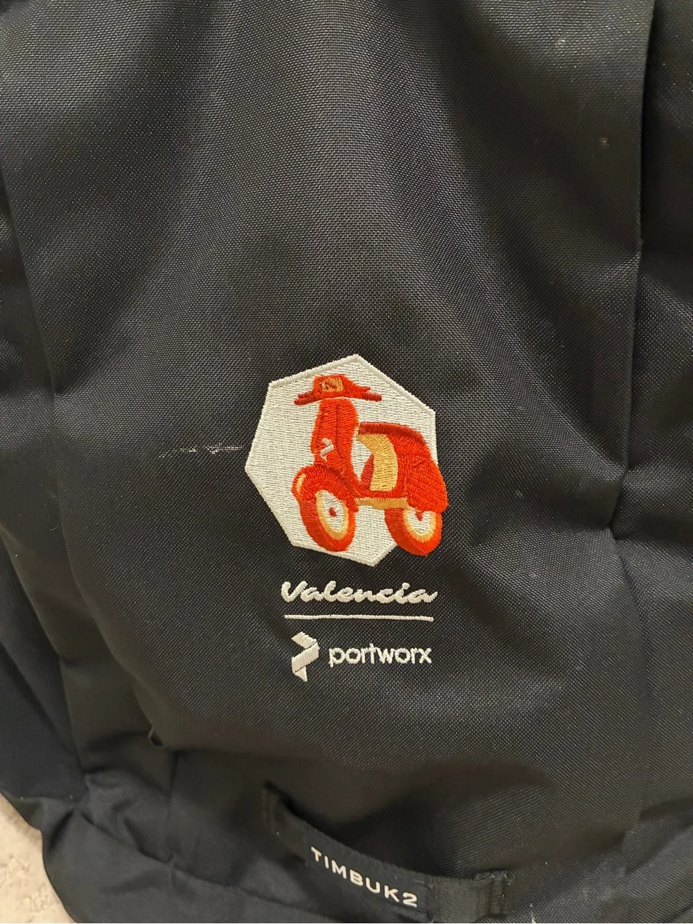 Timbuk2 Black Backpack with Orange Valencia Graphic